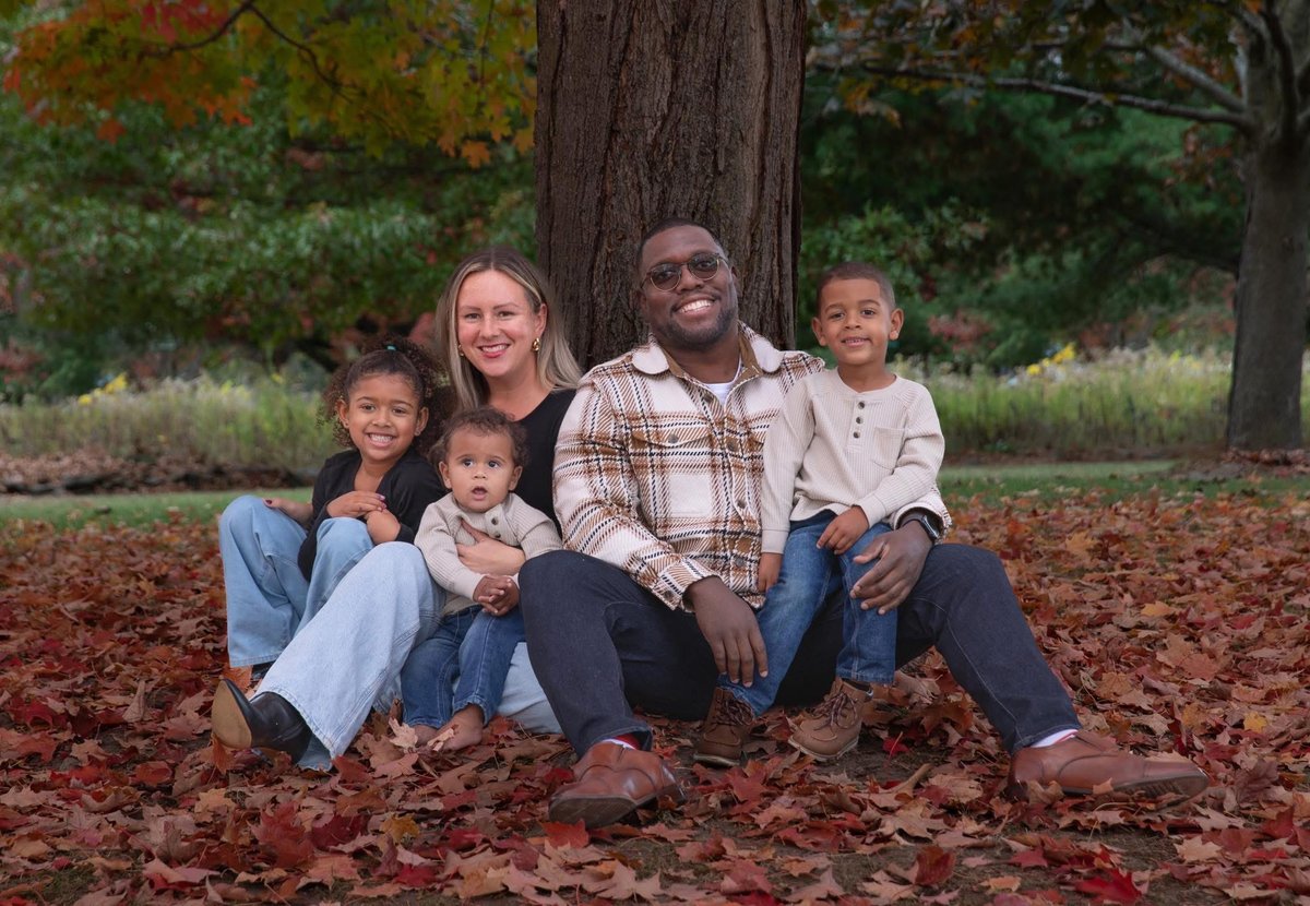 Sly Gittens with his wife Molly and their three children